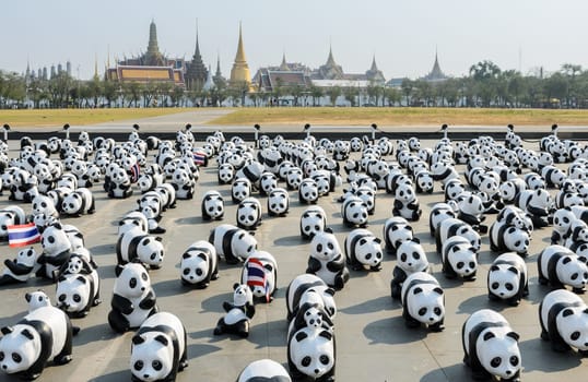 BANGKOK, THAILAND - MARCH 4, 2016: Exhibition of the 1,600 paper-mache panda sculptures world tour collaboration between WWF and French artist Paulo Grangeon at Sanam Luang in Bangkok, Thailand.