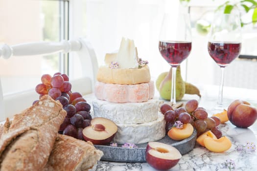 Stacks of different soft caess with fresh fruit