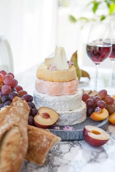 Stacks of different soft caess with fresh fruit