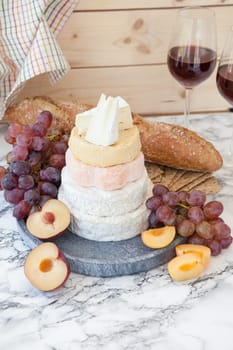 Stacks of different soft caess with fresh fruit