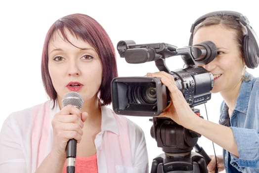 a young woman journalist with a microphone and camerawoman