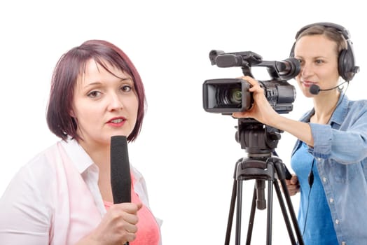 a young woman journalist with a microphone and camerawoman