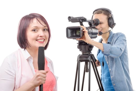 a young woman journalist with a microphone and camerawoman