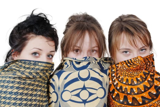 portrait of three pretty girls with scarves, on white