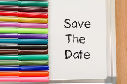 Save the date text concept and colored pens