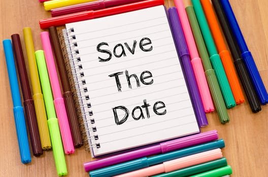 Save the date text concept and colored pens