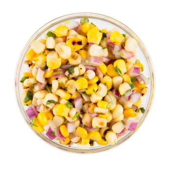 Bowl of grilled corn and onion mix isolated on white and viewed from above.