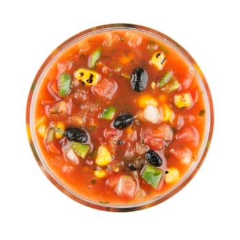 Bowl of grilled corn and black bean salsa isolated on white and viewed from above.
