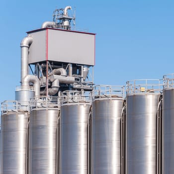 Detail of chemical plant, silos and pipes