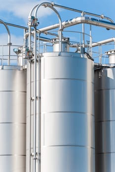 Detail of chemical plant, silos and pipes