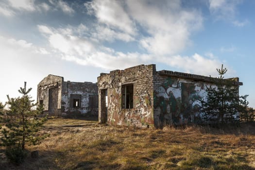 A couple of old ruined stone brick houses in former Soviet Army base