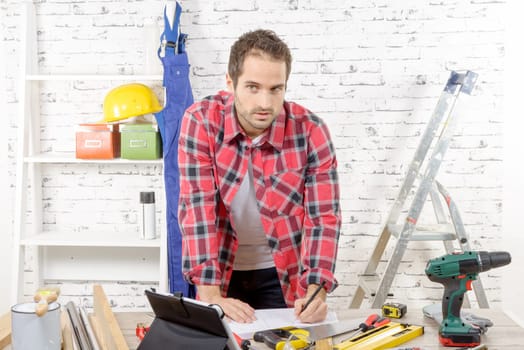 a young carpenter in his workshop