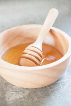 Golden honey cup and dipper, stock photo