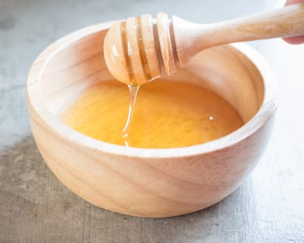 Golden honey cup and dipper, stock photo