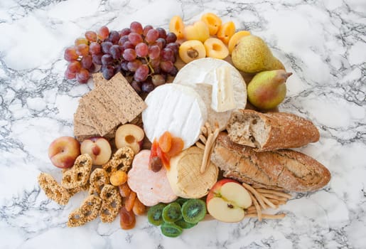 Rustic kaese platte with fruits and crisps