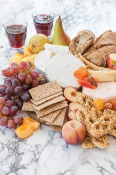 Rustic kaese platte with fruits and crisps