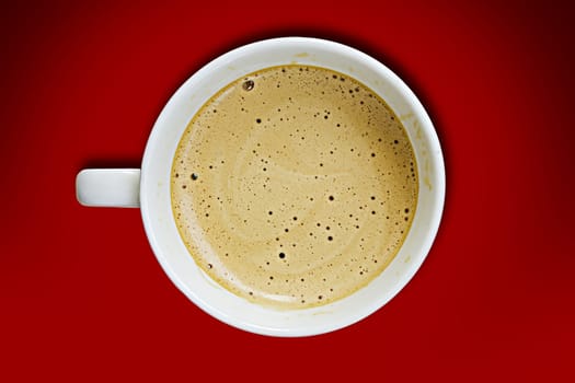 Coffee cup on a red background.