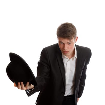 A young well dressed man greeting with his hat