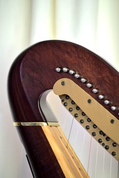 Closeup of the neck and mechanisms of a concert grand pedal harp