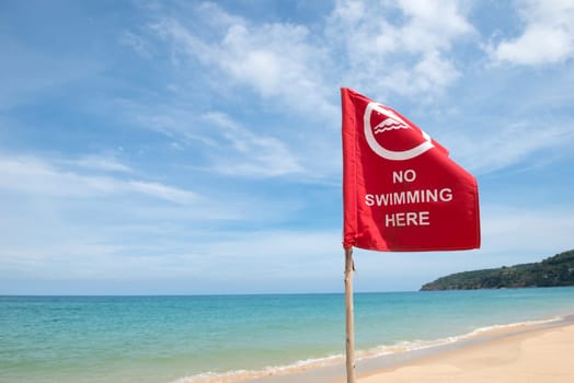 No swimming danger sign at the beach