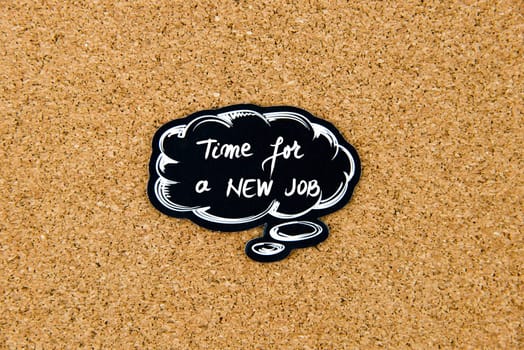 TIME FOR A NEW JOB written on black thinking bubble over cork board background, copy space available