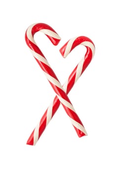 Two christmas candycanes forming a heart shape