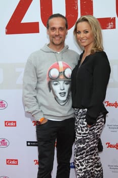 Alex Christensen with wife at the Zulu premiere in Hamburg