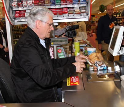 Sky du Mont at the request round-up action at REWE for disadvantaged children
