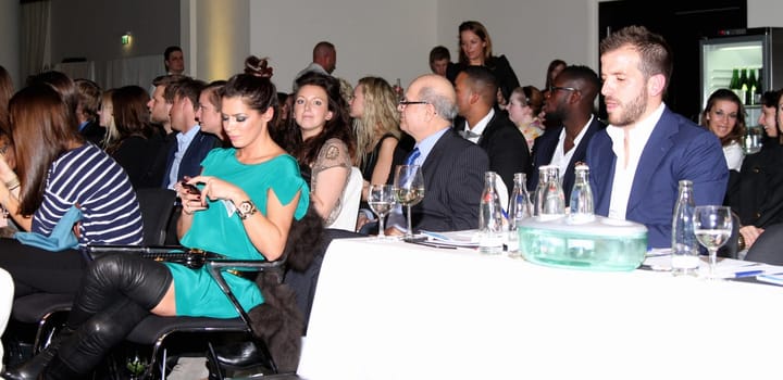Rafael van der Vaart and Sabia Boulahrouz flirting at an event