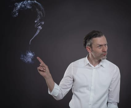 Business man with a big question mark of steam on a dark background
