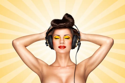 Retro photo of a nude pin-up girl with big vintage music headphones on colorful abstract cartoon style background.