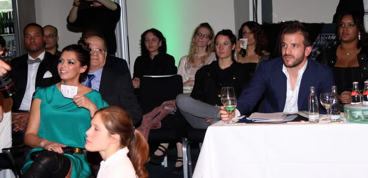 Rafael van der Vaart and Sabia Boulahrouz flirting at an event