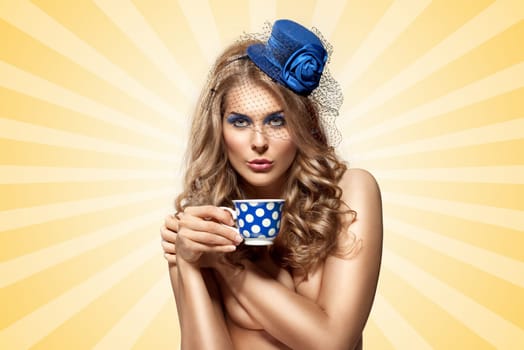 Creative vintage photo of a beautiful naked pin-up girl in a hat, drinking tea or coffee from a polka dot cup on colorful abstract cartoon style background.