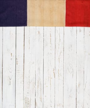 French flag on a white painted wooden wall