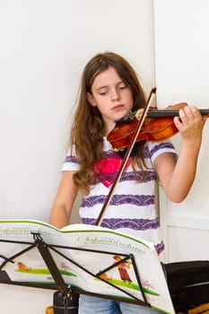 Girls practicing the violin
