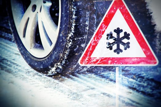 Winter tyres with road sign
