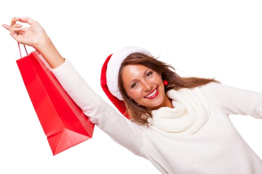 Attractive young woman with Santa hat holds laughing a red shopping bag sale final sale in hand on white background with text free space Insulated freeholder