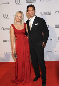 Ornella Muti and Fabrice Kerherve arrive for the UNESCO Charity Gala 2010 at Maritim..  at 30/10/2010