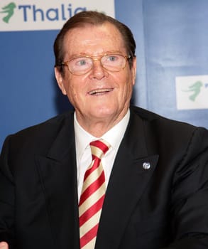 Sir Roger Moore and wife Lady Kristina at Thalia Hamburg where he presented his book My Word Is My Bond