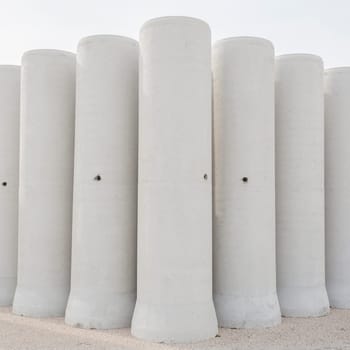 Concrete drainage pipes for industrial building construction.