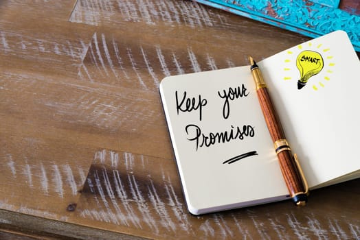 Handwritten text Keep Your Promises with fountain pen on notebook. Concept image with copy space available.