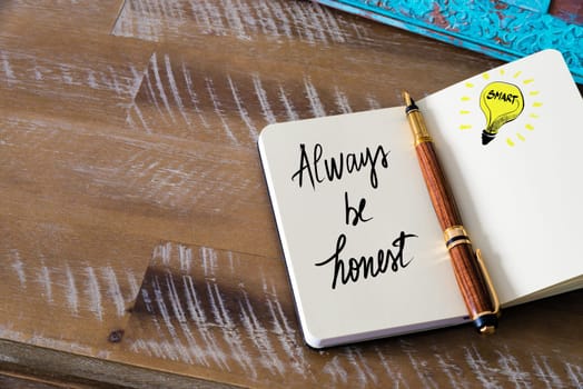 Handwritten text Always Be Honest with fountain pen on notebook. Concept image with copy space available.