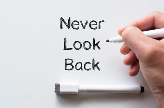 Human hand writing never look back on whiteboard