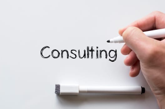 Human hand writing consulting on whiteboard