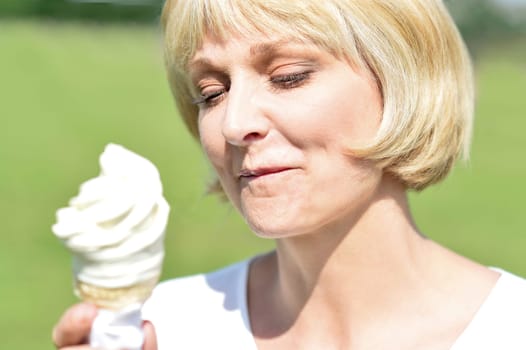 Attractive woman on vacation having fun and eating ice cream