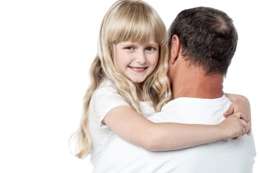 Happy little girl resting on her father's shoulder.