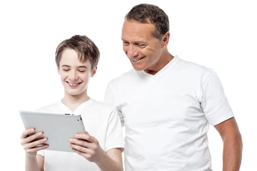 Dad and son using a tablet pc over white background.