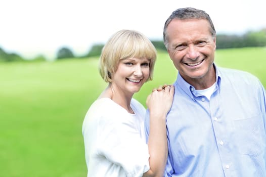 Portrait of happy beautiful couple on nature.