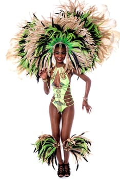 Beautiful samba dancer wearing green costume and posing