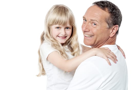 Portrait of happy man holding his daughter over white.